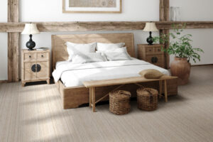 Windsor | The Design Emporium Rustic bedroom with a wooden bed, matching nightstands, a bench, and wicker baskets in front of the bed.